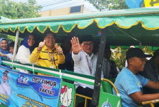 Pilkada OKU Timur, Fery - Herly Naik Odong-odong Daftar ke KPU, Janji Berdayakan Ekonomi Kreatif 