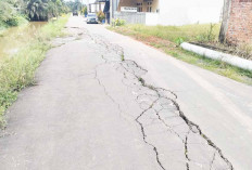Nyaris Amblas, Badan Jalan Miring Sebagian