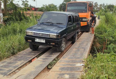 Ban Mobil Slip di Jembatan Rangka Baja