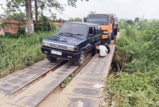 Ban Mobil Slip di Jembatan Rangka Baja