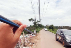Kabel Internet Menjuntai ke Badan Jalan