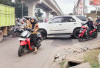 Lubang di Turunan Jalan Srijaya KM 5 Telah Ditambal
